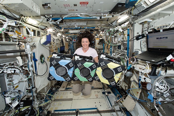 image of an astronaut working with an experiment