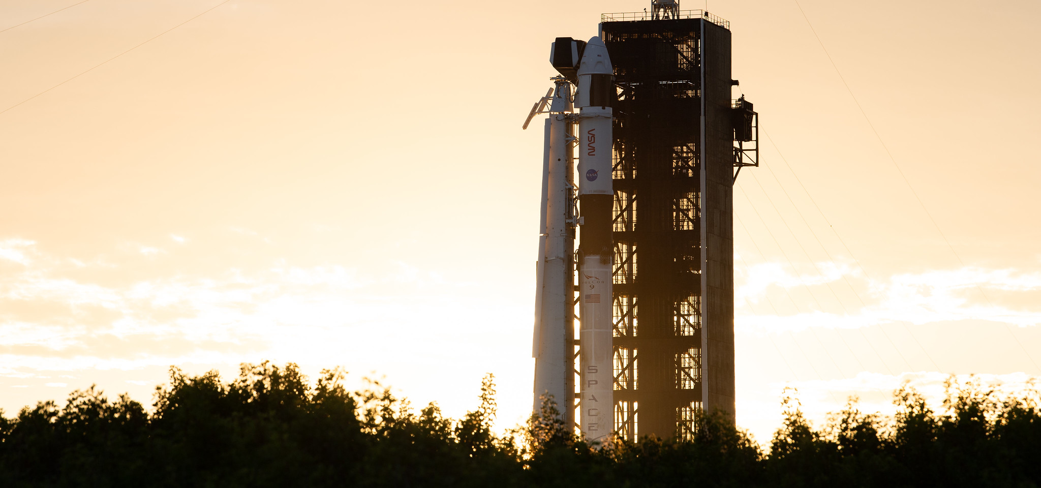 A SpaceX Falcon 9 rocket with the company's Crew Dragon spacecraft onboard is seen at sunset on the launch pad at Launch Complex 39A as preparations continue for the Crew-3 mission, Wednesday, Oct. 27, 2021, at NASA’s Kennedy Space Center in Florida.
