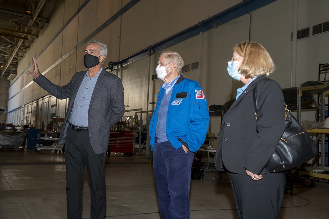 NASA Administrator Bill Nelson and NASA Deputy Administrator Pam Melroy listen to NASA Armstrong Flight Research Center Director David McBride, at left, tell them about Building 703 in Palmdale, California.