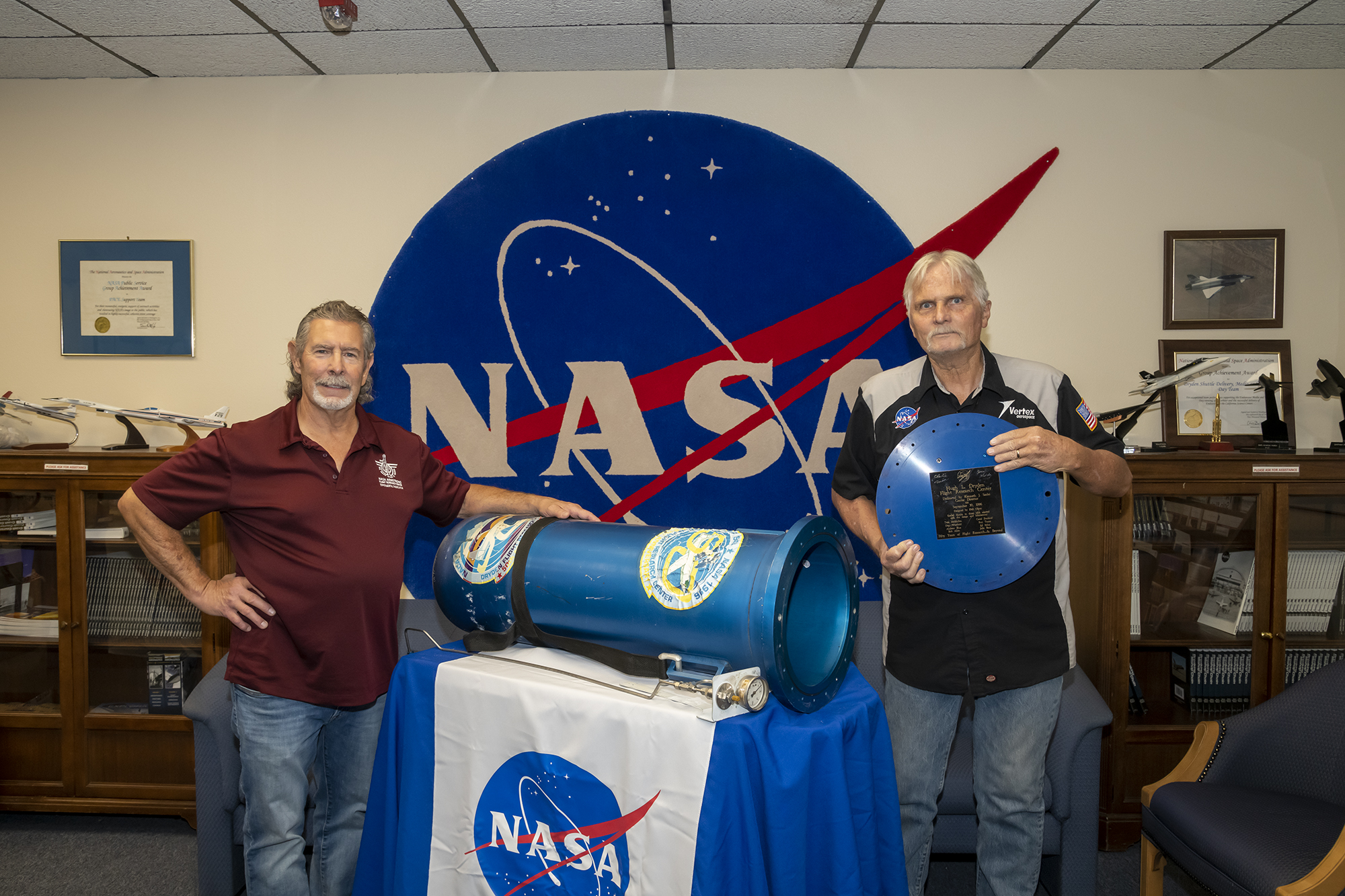 People standing by a time capsule.