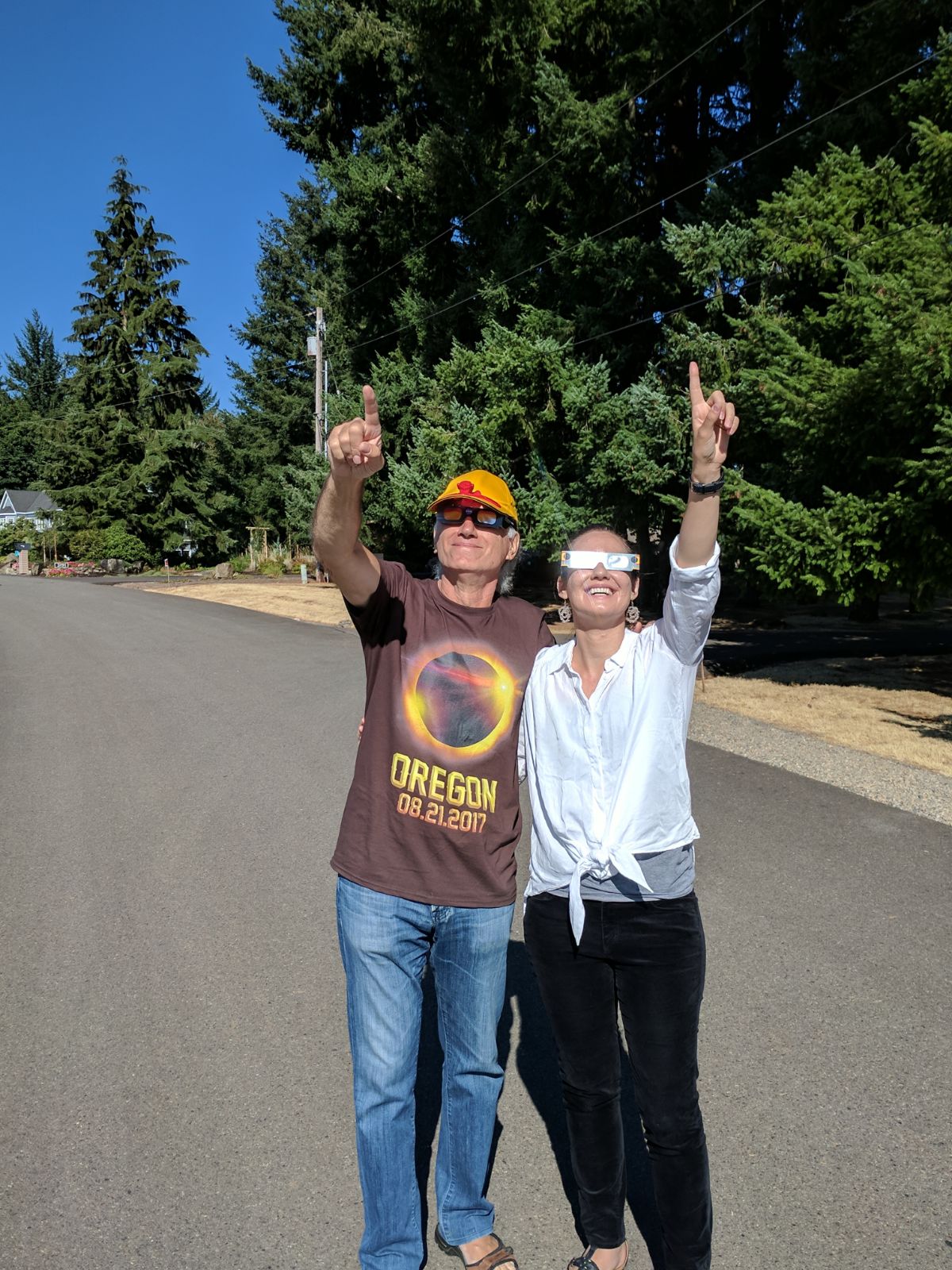 Dr. Aleida Higginson and her Goddard thesis advisor, Dr. Spiro Antiocho,s preparing to watch the great American solar eclipse in Oregon in 2017.