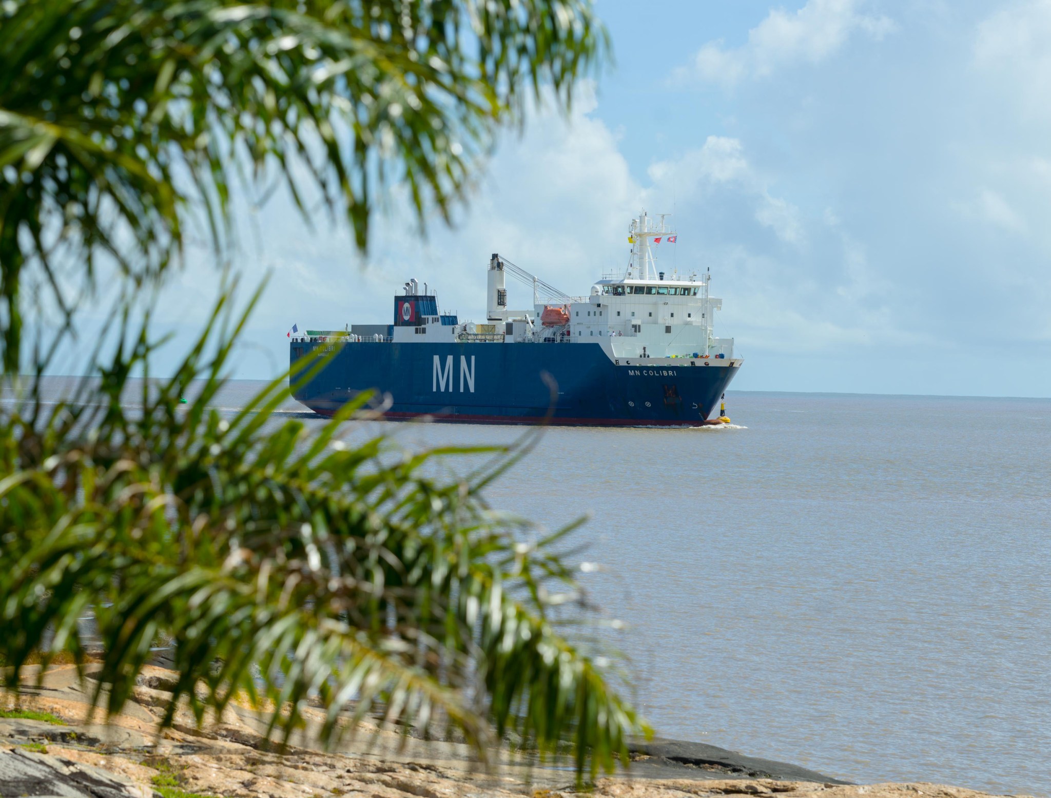 The ship MN Colibri, seen from shore, as it enters Port de Pariacabo.