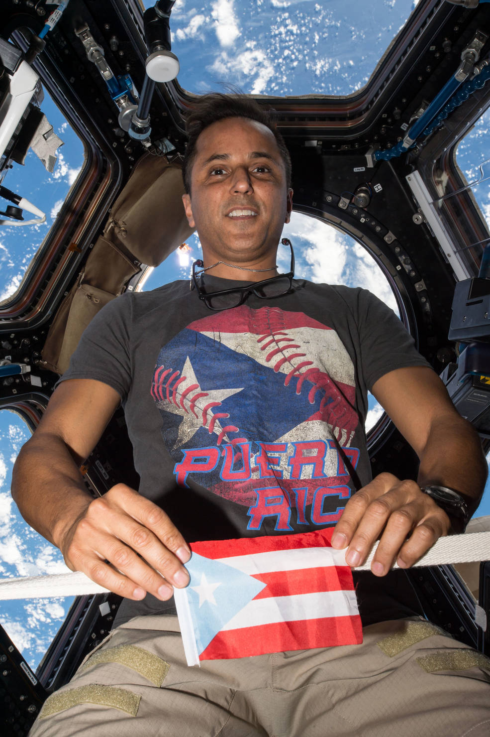 iss20_hhm_acaba_exp_53_w_puerto_rico_flag_and_t_shirt_in_cupola