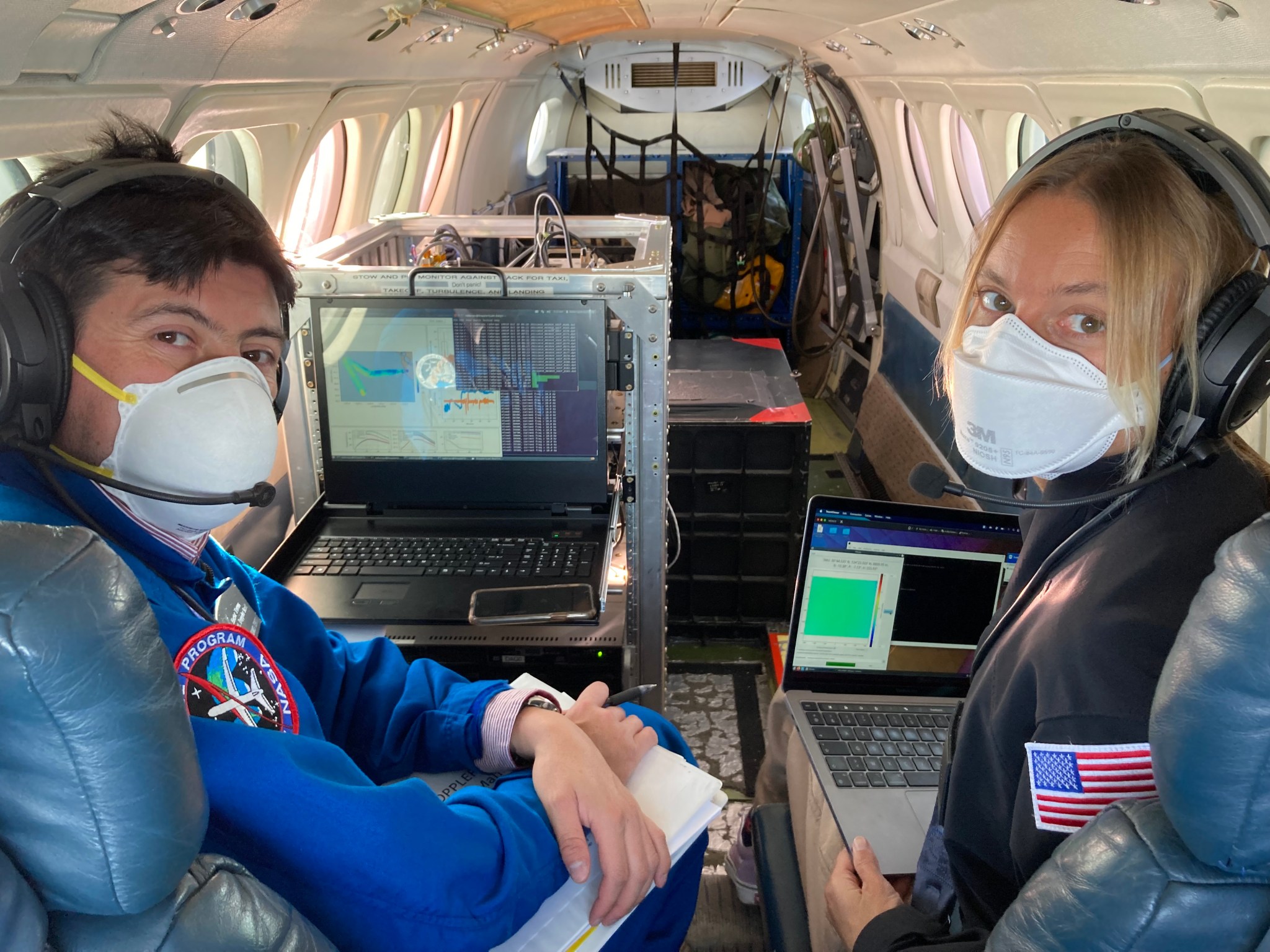 Hector Torres from NASA JPL and Delphine Hypolite from the University of California, Los Angeles onboard the AFRC B200 aircraft during the S-MODE flights.
