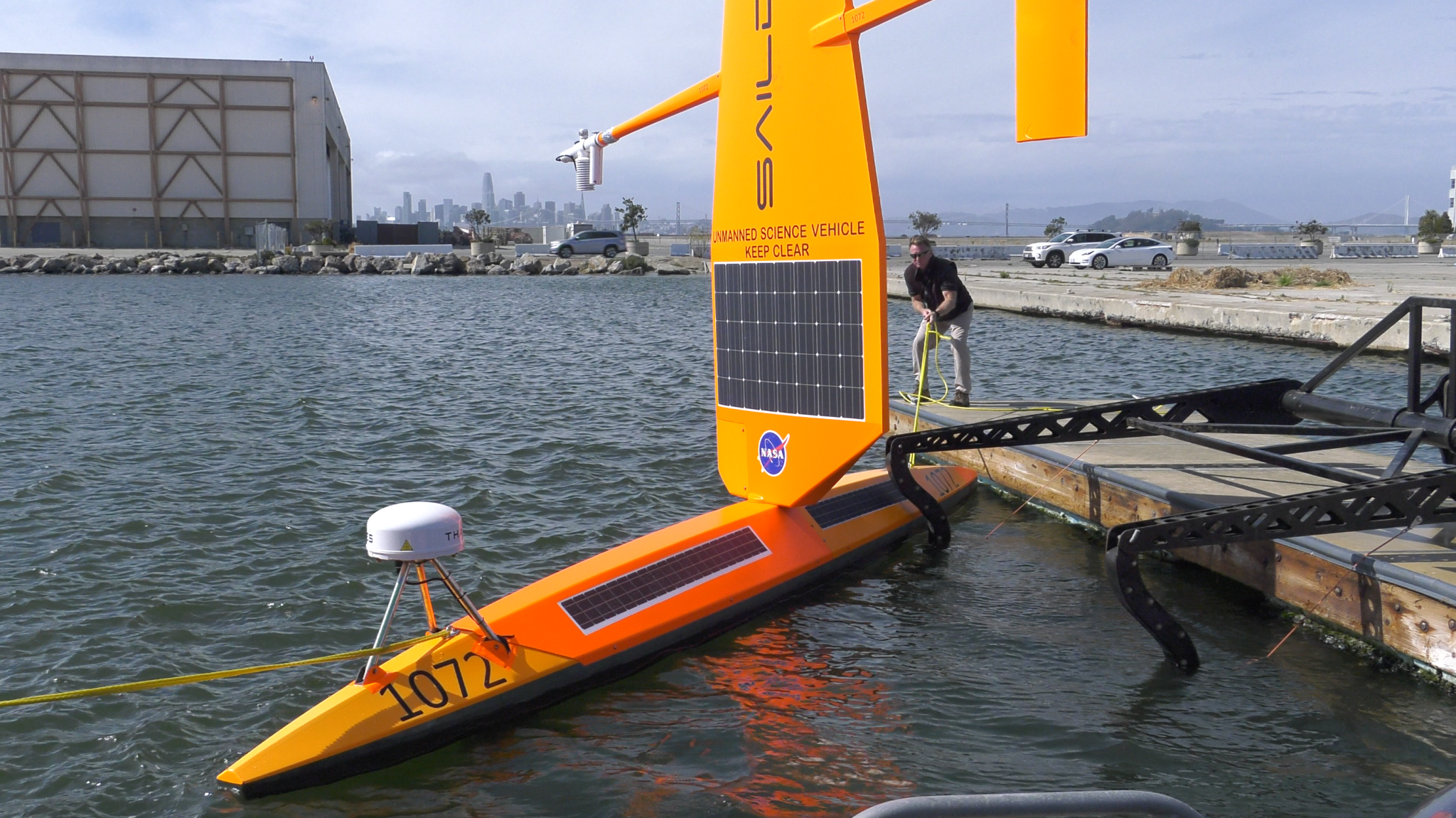 A type of autonomous marine robot called a Saildrone being deployed. 