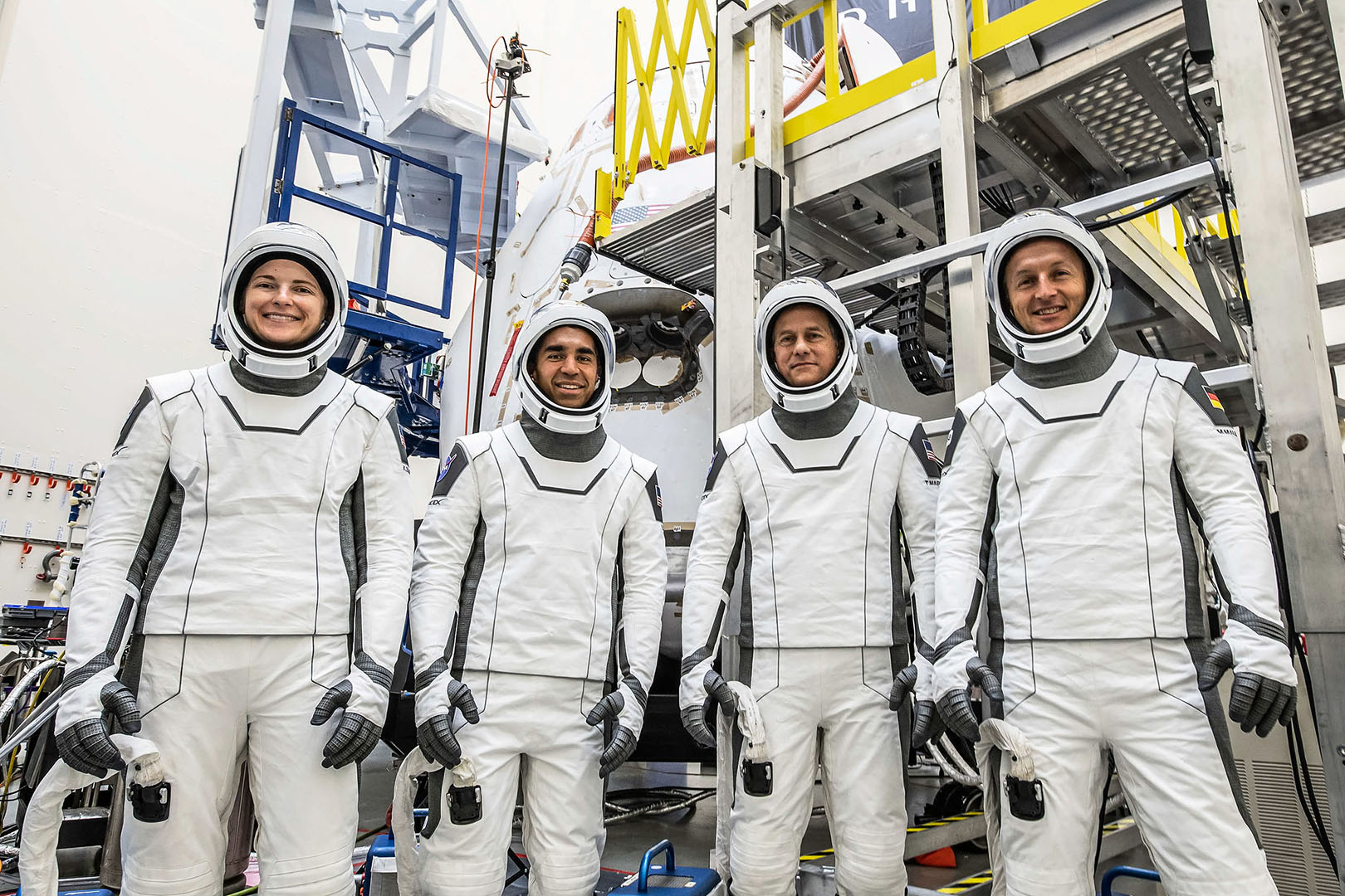 The Crew-3 astronauts in their white SpaceX spacesuits.