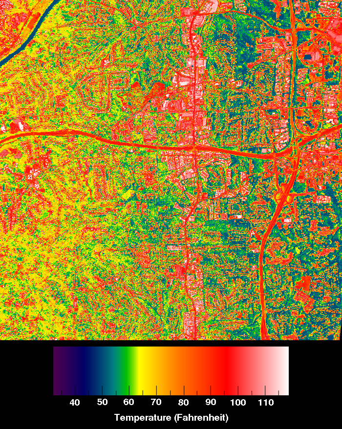 A satellite image showing temperatures across a suburban area, with roadways and other manmade surfaces significantly hotter than areas with vegetation.