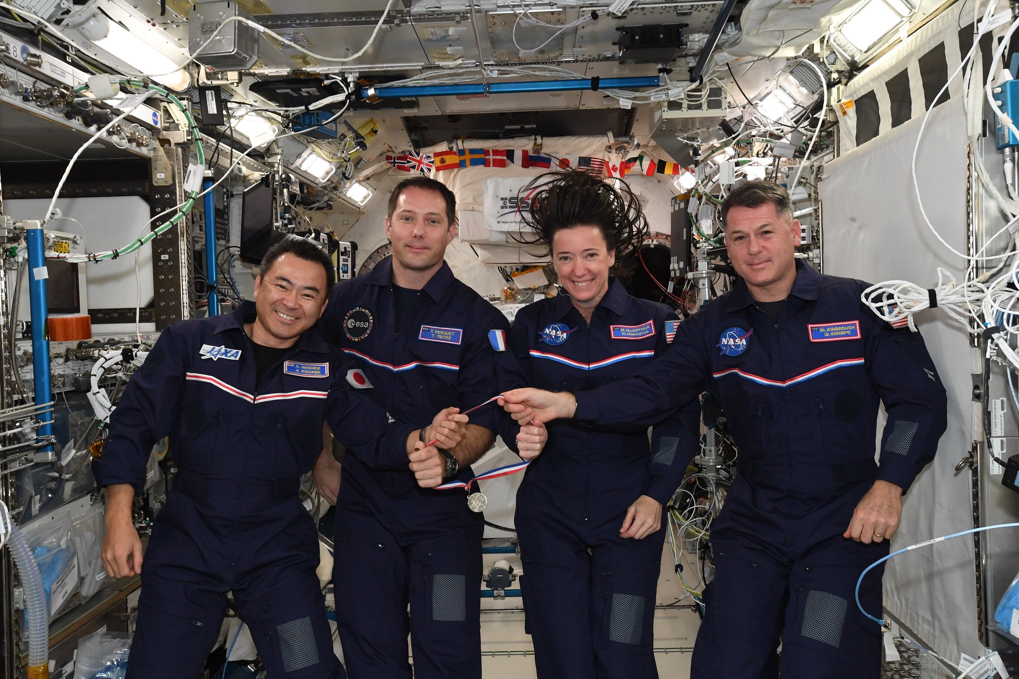 Astronauts Akihiko Hoshide of JAXA (Japan Aerospace Exploration Agency), left, Thomas Pesquet of ESA (European Space Agency), and Megan McArthur and Shane Kimbrough of NASA