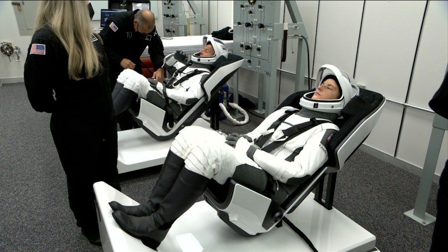 SpaceX suit technicians check the Crew-3 astronauts' spacesuits inside the Astronaut Crew Quarters at Kennedy Space Center on Nov. 10, 2021.