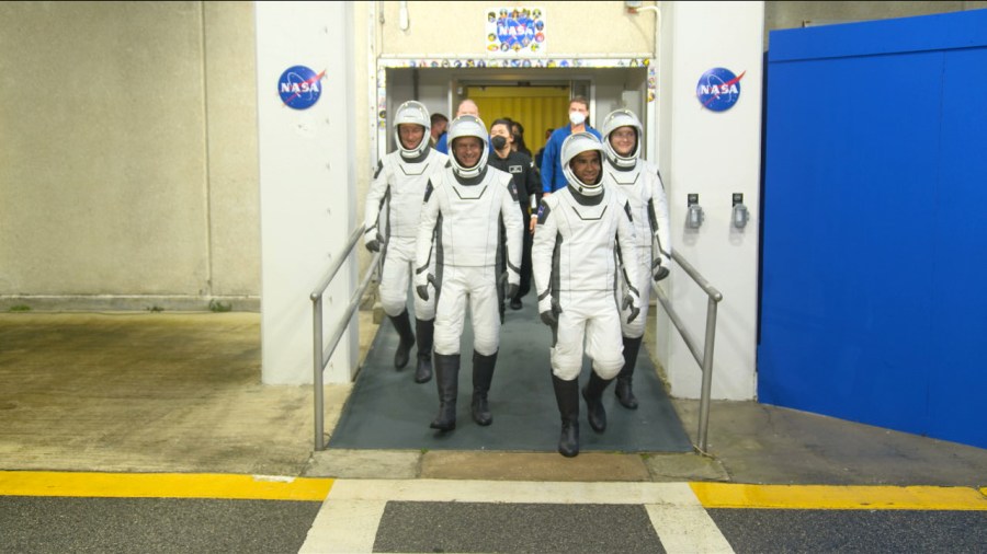 NASA's SpaceX Crew-3 astronauts walk outside the Neil A. Armstrong Operations and Checkout Building to head out to the launch pad for the Crew-3 launch on Nov. 10, 2021.