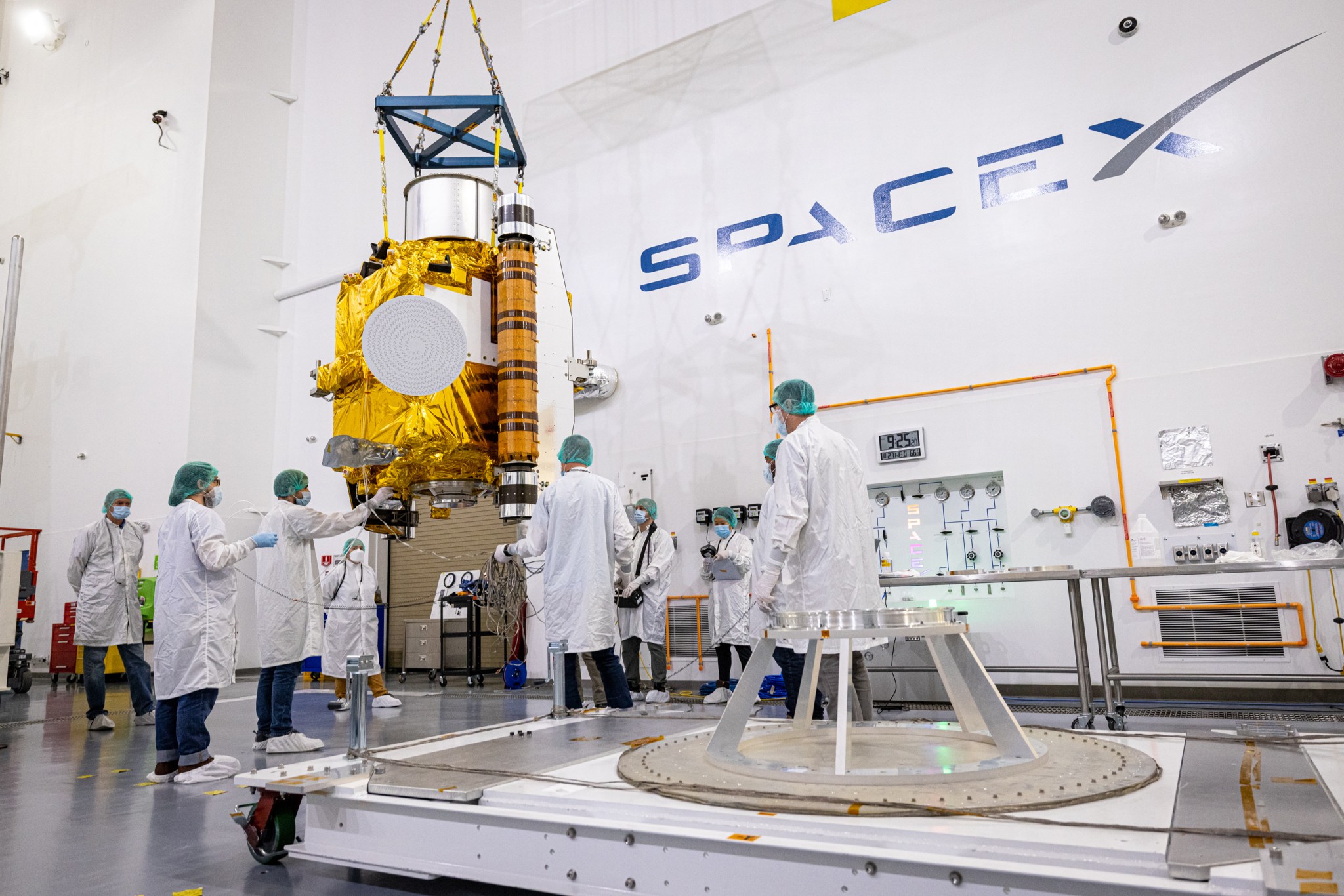 DART team members carefully removed the spacecraft from its shipping container and moved it to a low dolly. 