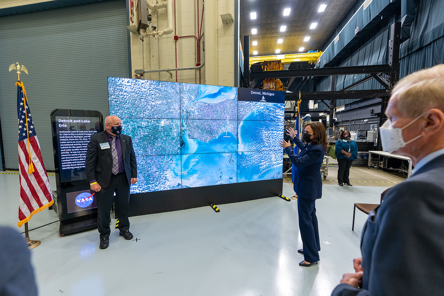 Vice President Kamala Harris views data visualizations on NASA's hyperwall.