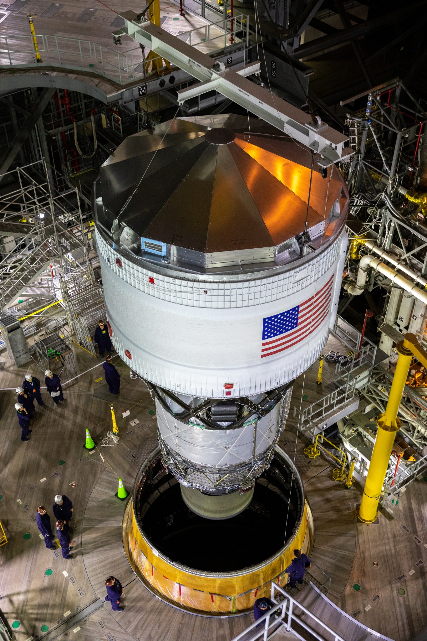 Teams with NASA’s Exploration Ground Systems and contractor Jacobs integrate the interim cryogenic propulsion stage (ICPS) for NASA’s Space Launch System (SLS) rocket with the launch vehicle stage adapter (LVSA) atop the massive SLS core stage in the agency’s Vehicle Assembly Building (VAB) at NASA’s Kennedy Space Center in Florida on July 5, 2021. The ICPS is a liquid oxygen and liquid hydrogen-based system that will fire its RL 10 engine to give the Orion spacecraft the big in-space push needed to fly tens of thousands of miles beyond the Moon. The next component to be stacked on top of ICPS will be the Orion stage adapter, which will connect the ICPS with the spacecraft. Through Artemis, NASA will send the first woman and the first person of color to the lunar surface, as well as establish a sustainable presence on and around the Moon. As the first in an increasingly complex set of missions, Artemis I will test SLS and Orion as an integrated system prior to crewed flights to the Moon.