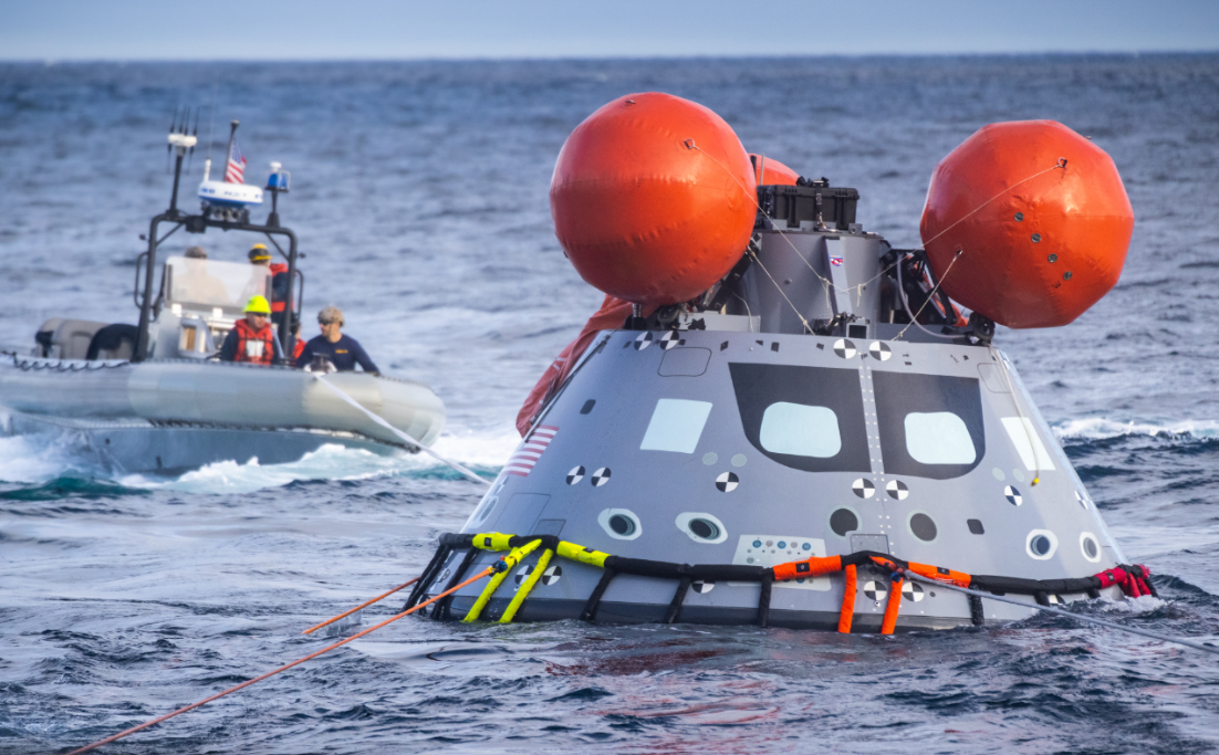 During Underway Recovery Test 9 (URT-9), NASA’s Landing and Recovery Team practices bringing a mock Orion capsule into the well deck of the USS John P. Murtha. 