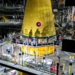 Teams at KSC integrate the LVSA with the massive SLS core stage on the mobile launcher in the VAB. Engineers used one of five VAB cranes to lift the adapter almost 250-feet in the air and then slowly lower it on to the core stage.