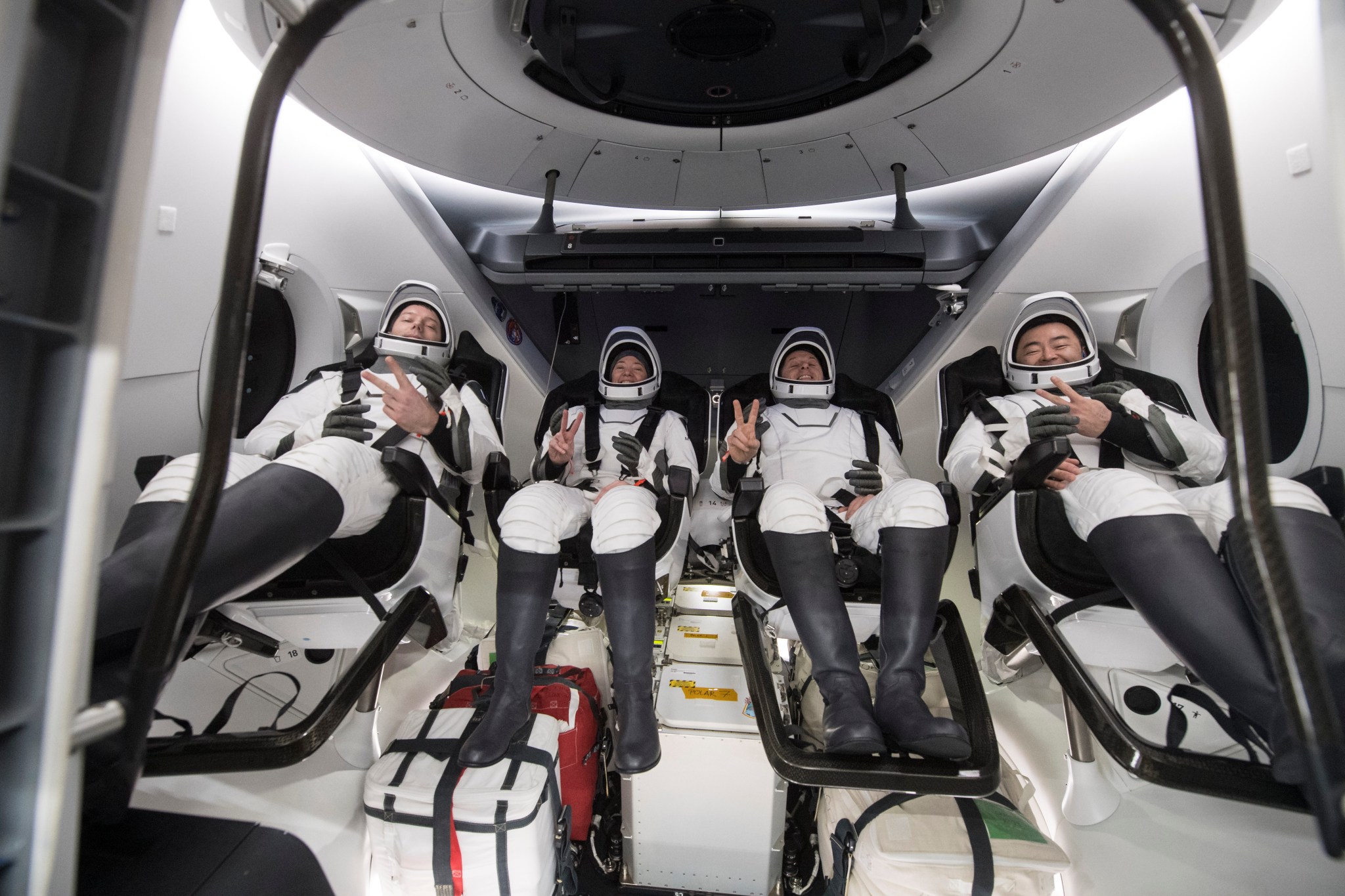 NASA's SpaceX Crew-2 mission astronauts smile and wave after splashing on Nov. 8, 2021.