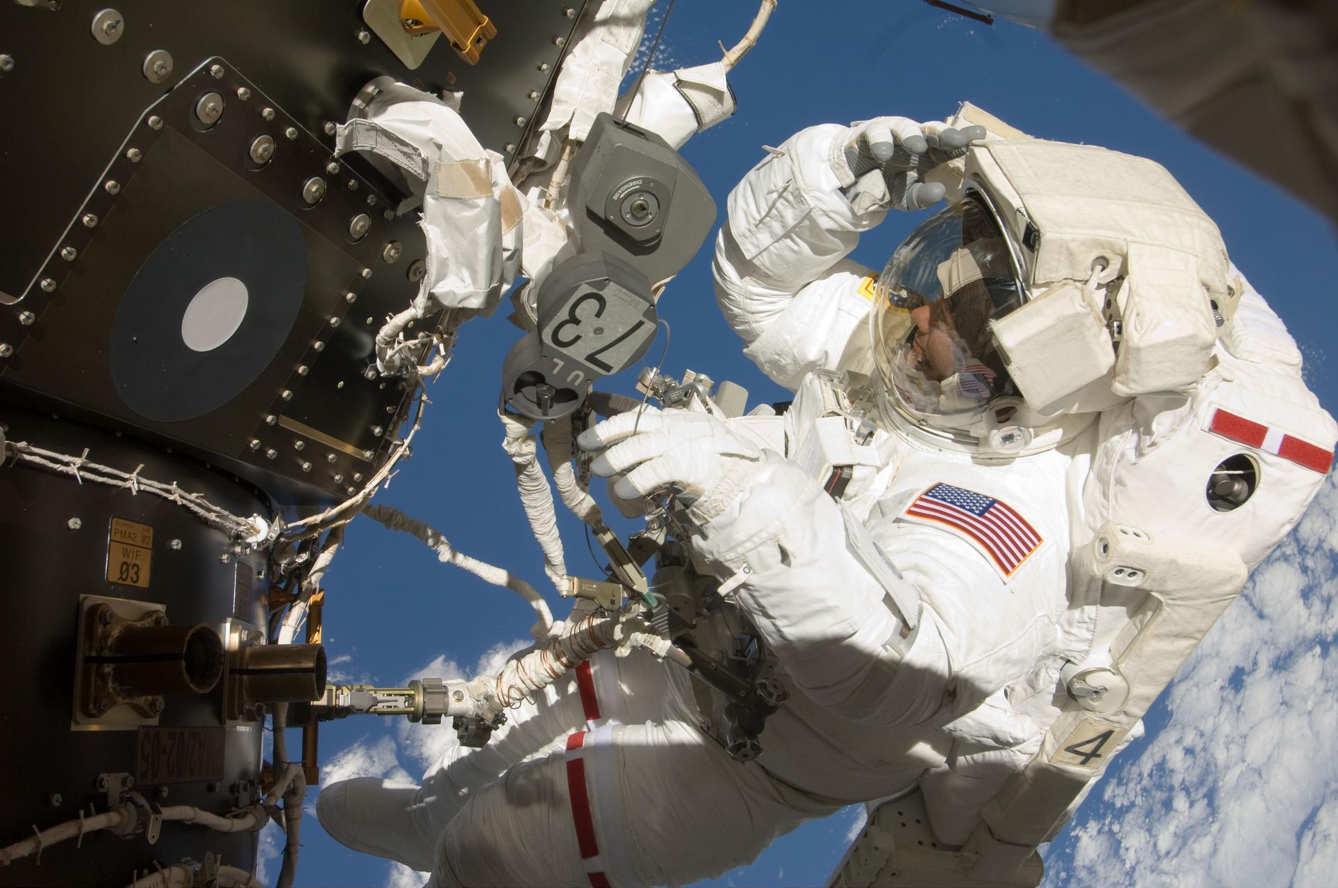Astronaut Tom Marshburn, STS-127 mission specialist, participates in his first spacewalk and the second overall for the crew members of the Space Shuttle Endeavour and the International Space Station July 20, 2009.
