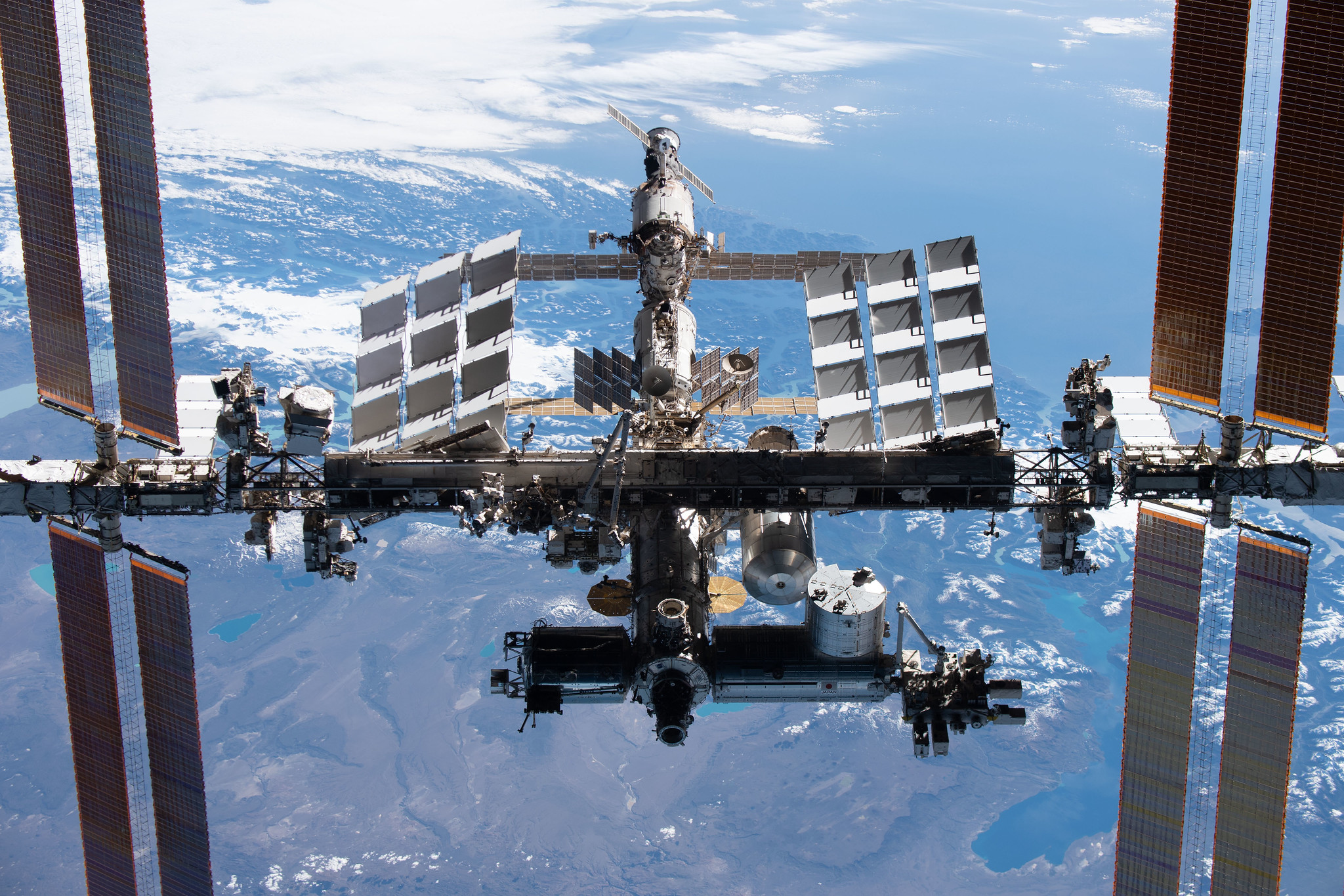 image of space station with Earth in backdrop