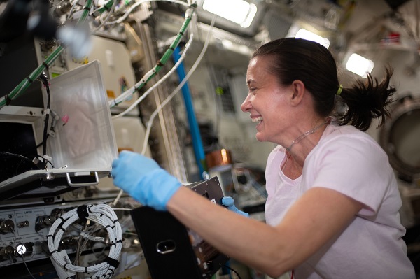 image of an astronaut working with an experiment