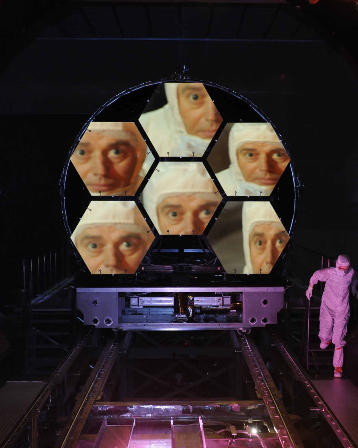 Project scientist Mark Clampin is reflected in the flight mirrors at Marshall Space Flight Center.
