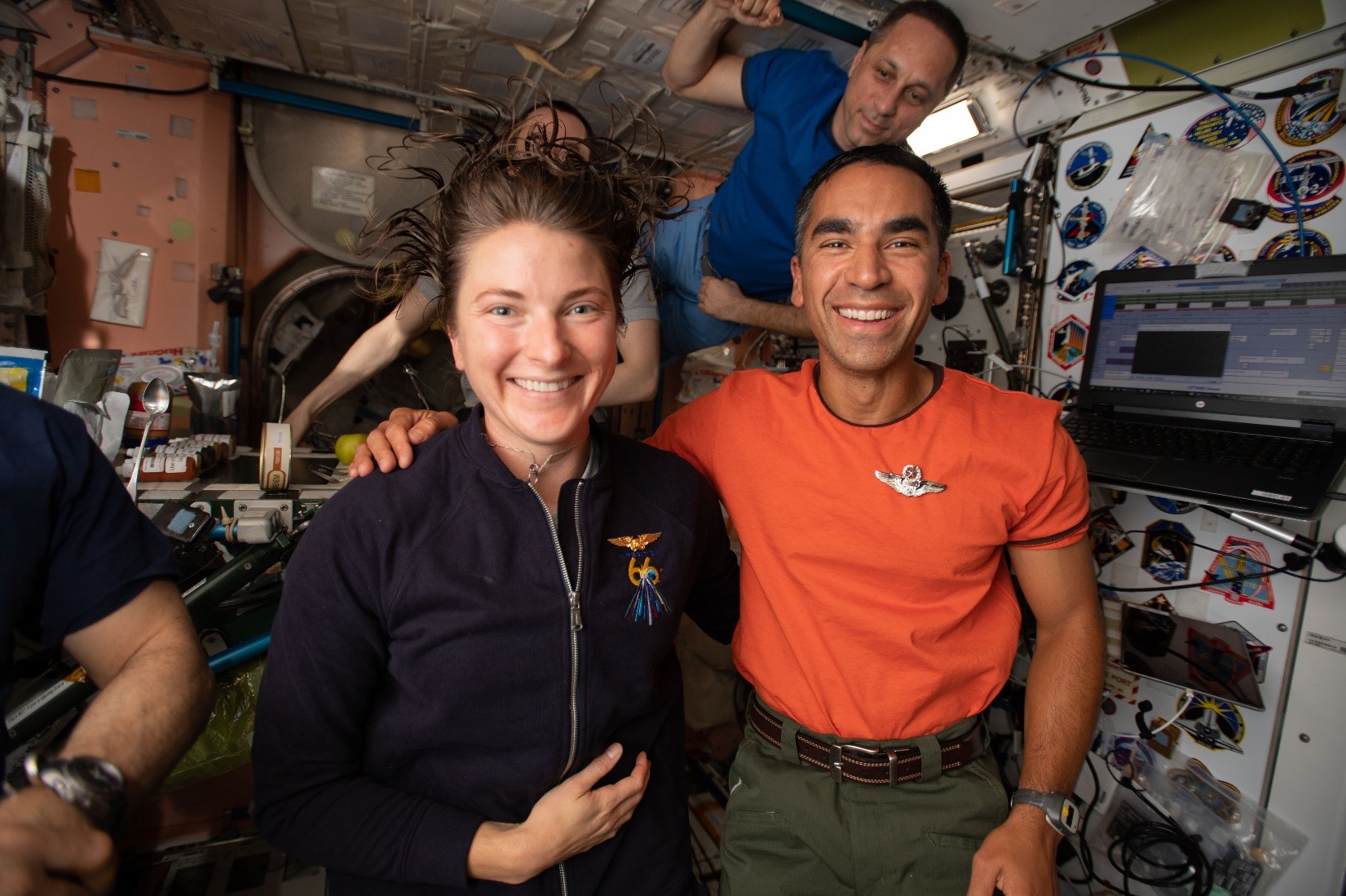 Astronauts Kayla Barron and Raja Chari pose for a portrait with Roscosmos cosmonaut Anton Shkaplerov.