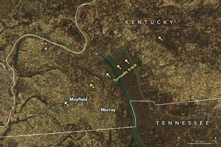 Natural color satellite image with arrows showing the path of the December tornado that tore through Kentucky can be seen from the MODIS instrument on NASA’s Aqua satellite.