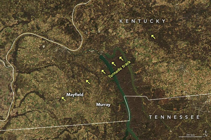 Natural color satellite image with arrows showing the path of the December tornado that tore through Kentucky can be seen from the MODIS instrument on NASA’s Aqua satellite.