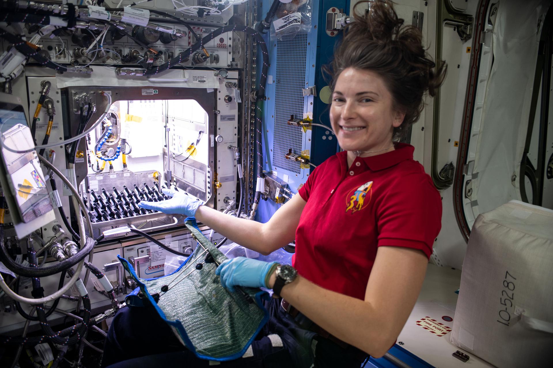 image of astronaut working with an experiment