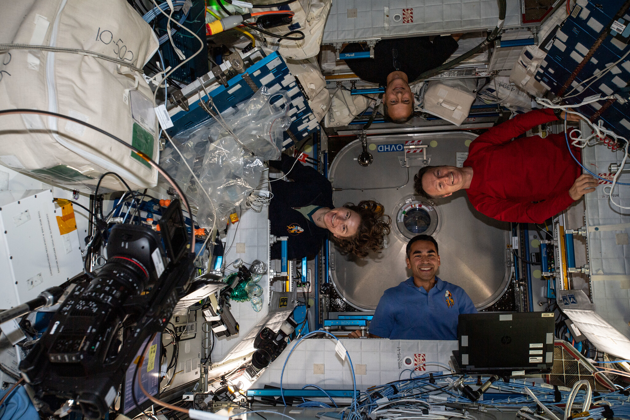 image of four astronauts in space station