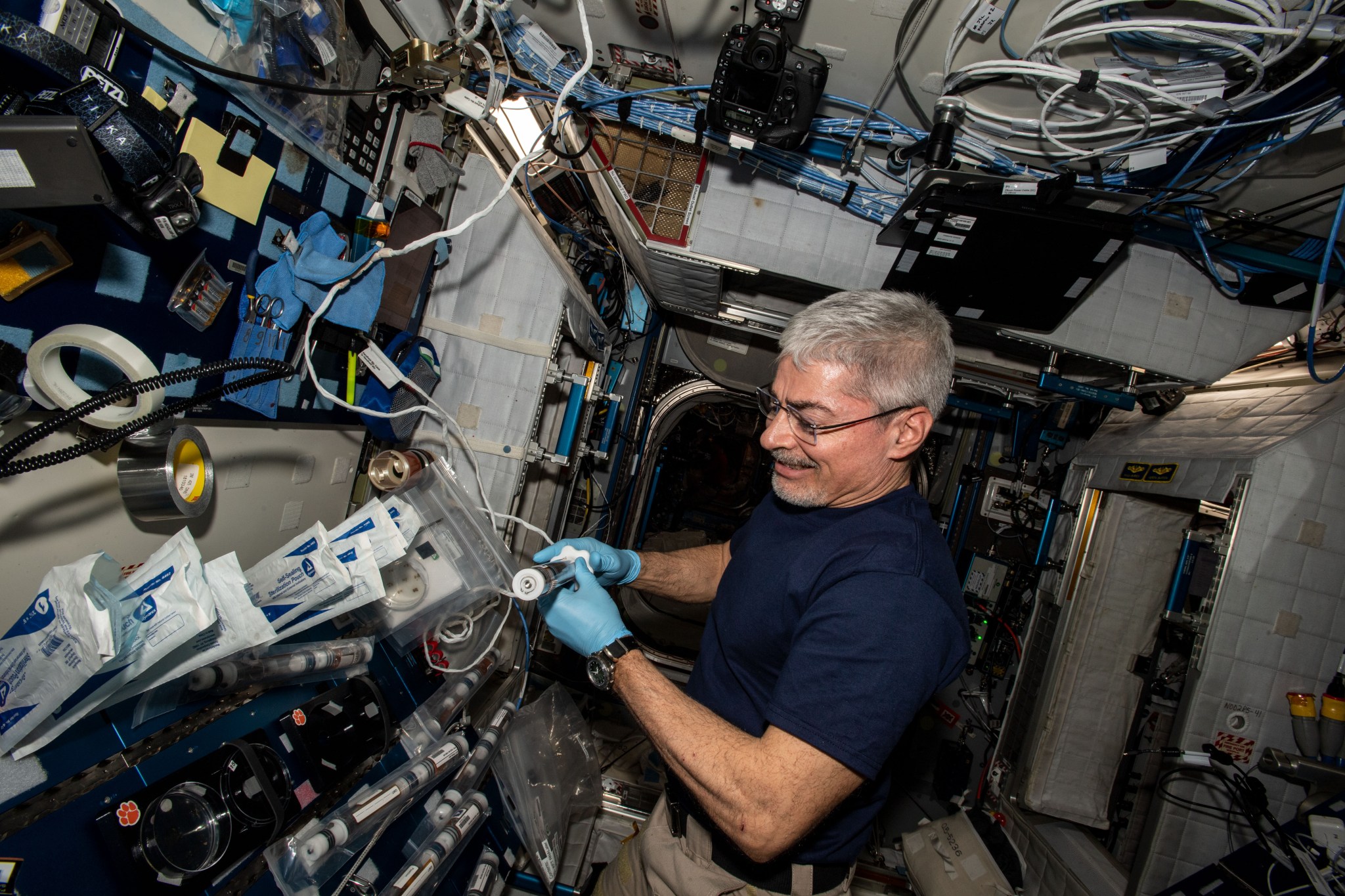 image of an astronaut working with an experiment