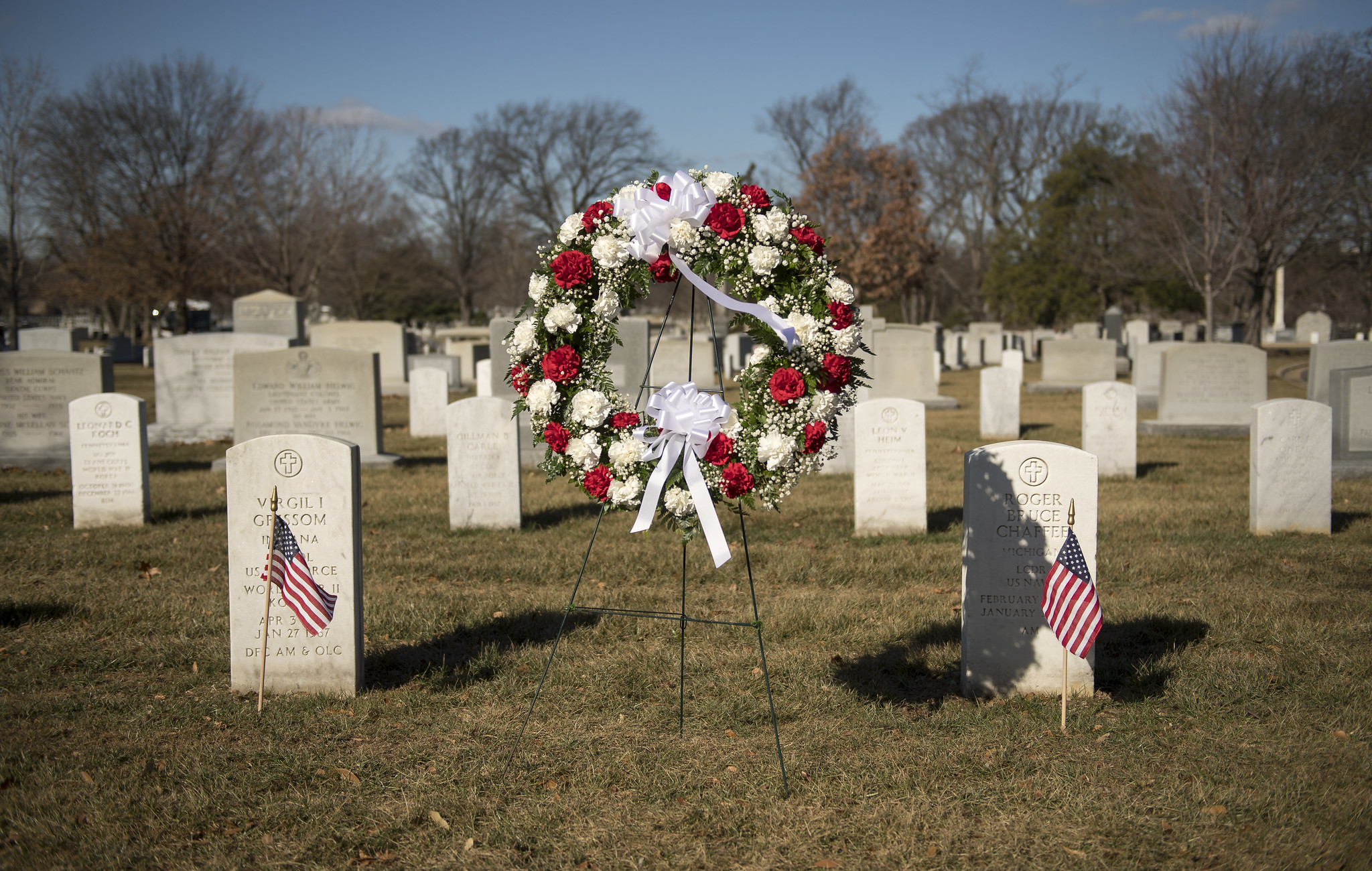 The graves of Apollo 1 crew members Virgil Grissom and Roger Chaffee seen during a wreath laying ceremony as part of NASA's 2018 Day of Remembrance at Arlington National Cemetery. 