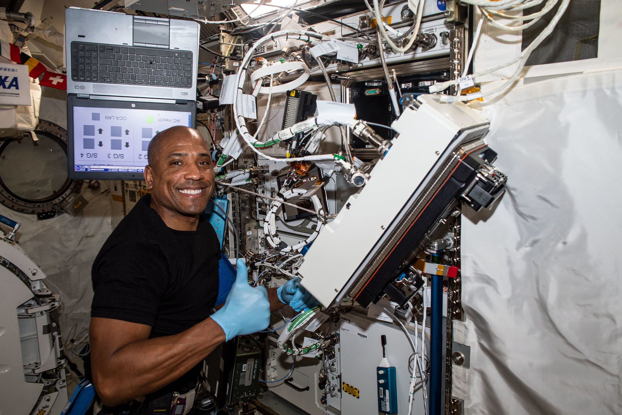 NASA astronaut and Expedition 64 Flight Engineer Victor Glover is pictured inside Japan's Kibo laboratory module installing research gear that will develop a biological model to study the effects of spaceflight on musculoskeletal disease.