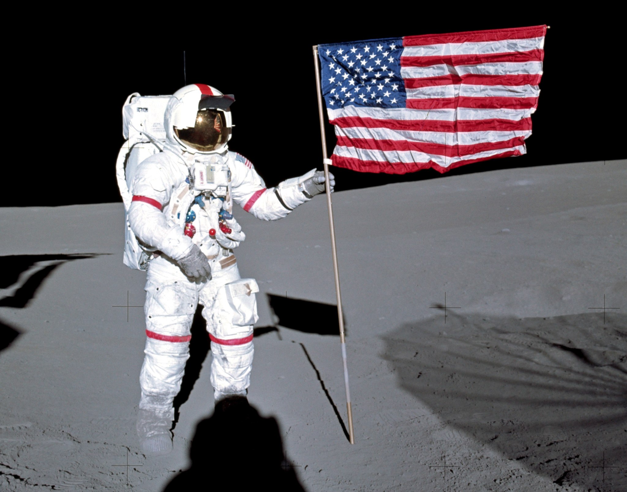 Alan Shepard plants the American flag on the moon