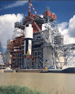 The first stage of the Saturn V rocket is hoisted into the B-2 stand at the Mississippi Test Facility