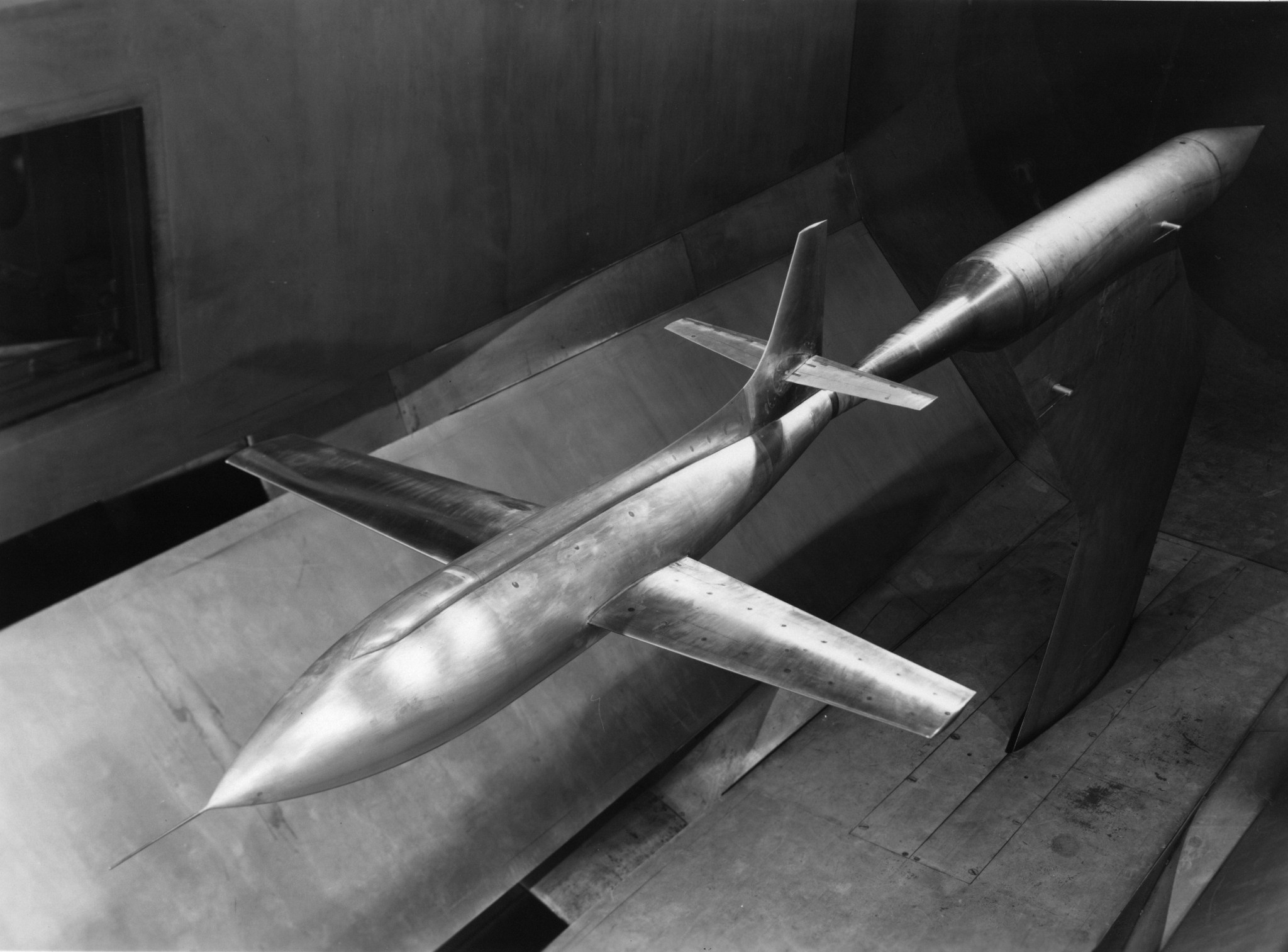 This sting-mounted aerodynamic model of the X-1 shows it being tested in the tunnel’s test section in 1951, about five years after the historic sound-breaking flight. 
