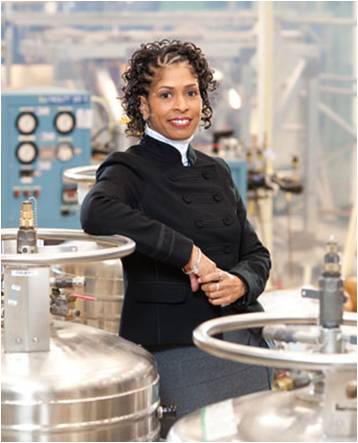 Photo of a woman standing in an engineering laboratory