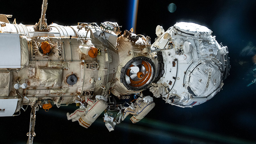 Cosmonauts Anton Shkaplerov and Pyotr Dubrov work outside the Nauka and Prichal modules during a seven-hour, 11-minute spacewalk.