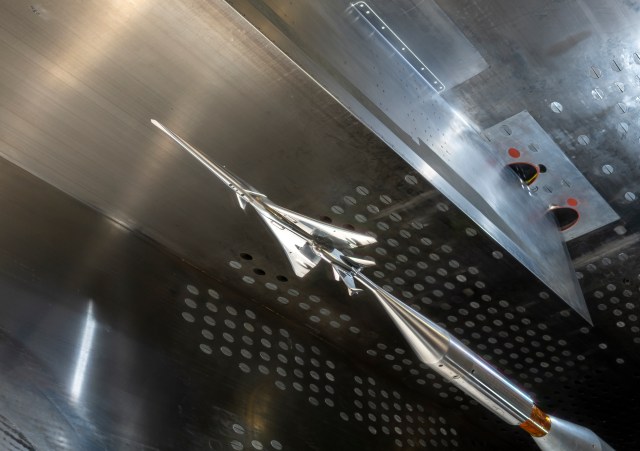 The X-59 model is shown from below, inside the wind tunnel.
