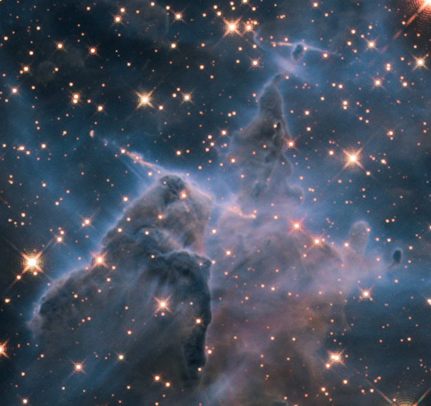 A view of the Carina Nebula in infrared. Infrared light is able to penetrate the clouds of dust to reveal what’s inside and what’s beyond.