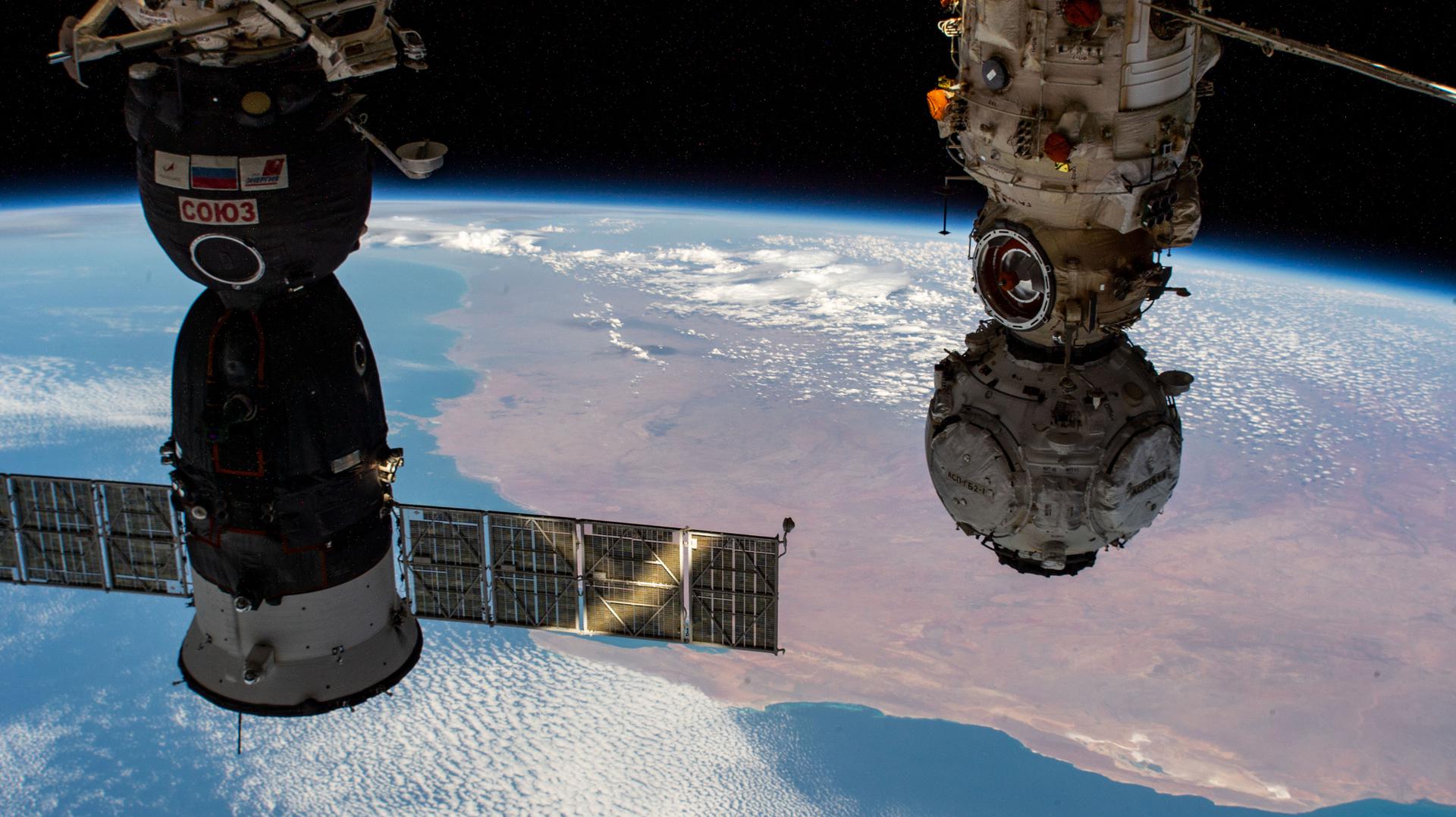 Pictured from left are the Soyuz MS-19 crew spacecraft and the Nauka Multipurpose Laboratory Module with the Prichal docking module attached as the International Space Station orbited 266 miles above the Indian Ocean off the western coast of Australia