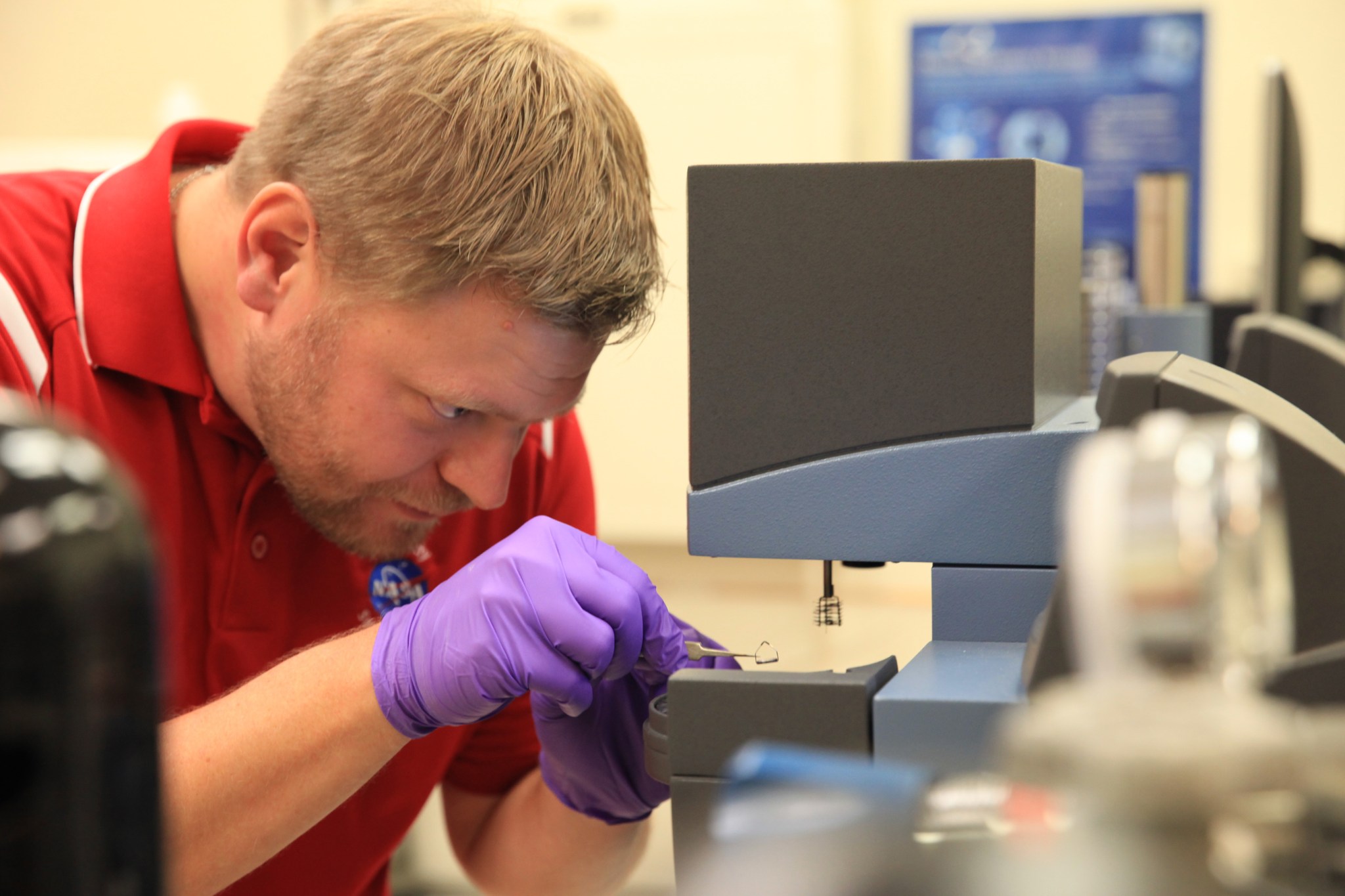 Jerry Buhrow, a materials engineer in the Materials Laboratories Branch of the Engineering Directorate at NASA’s Kennedy Space Center, works the thermal equipment.