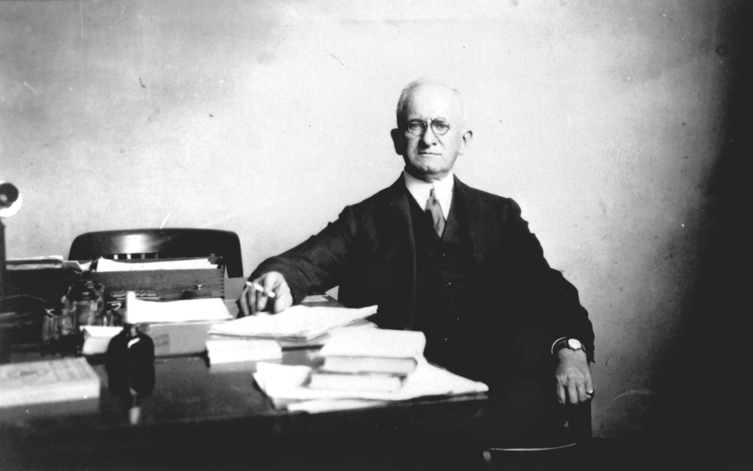 Dr. Joseph Sweetman Ames at his desk at the NACA headquarters. Dr. Ames was a founding member of NACA (National Advisory Committee for Aeronautics), appointed by President Woodrow Wilson in 1915. Ames took on NACA's most challenging assignments but mostly represented physics.