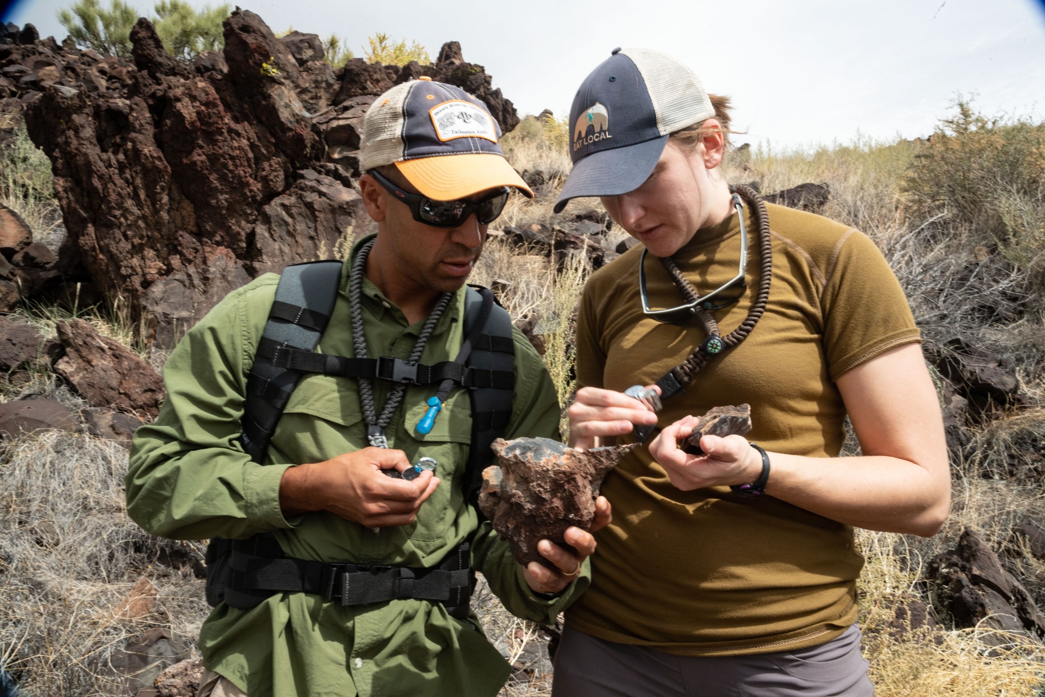 2017 NASA astronaut candidates Raja Chari and Kayla Barron examine samples during geology training in Arizona.