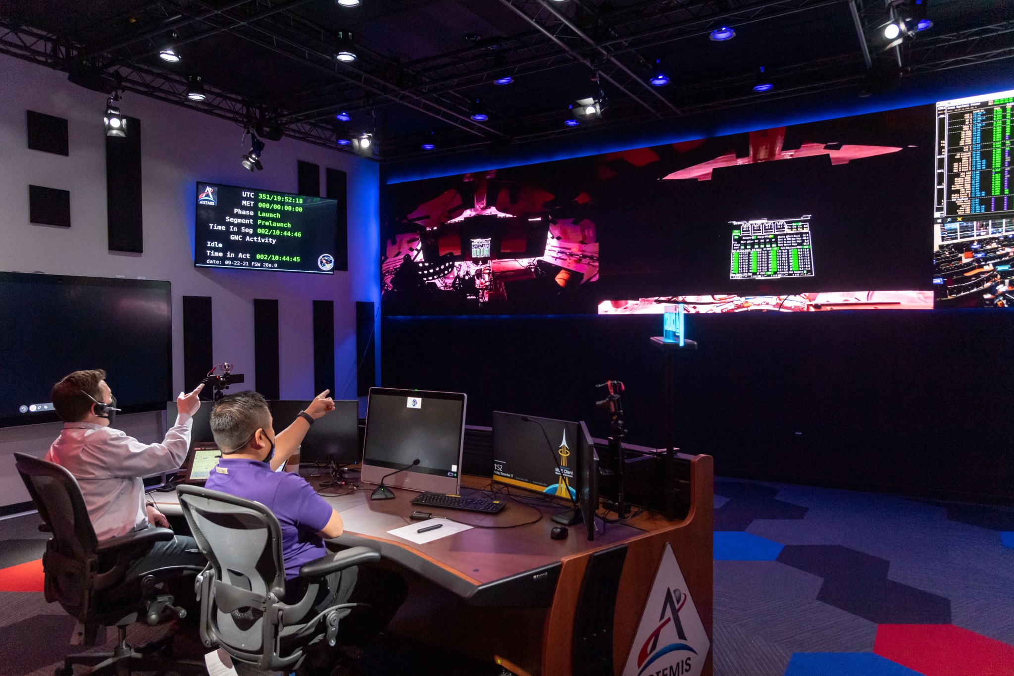 Howard Hu and Brian Jones observing Orion signals from Kennedy Space Center within Ops Suite 5 at Johnson Space Center