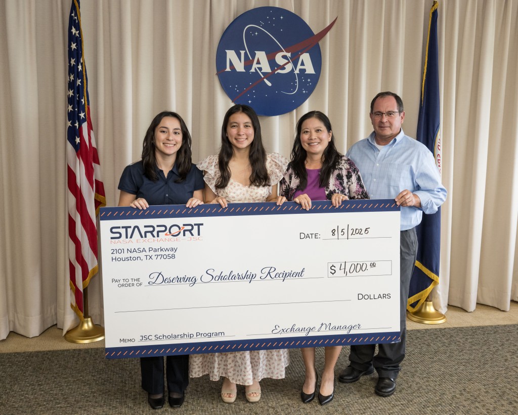 A group of individuals holding an oversized check.