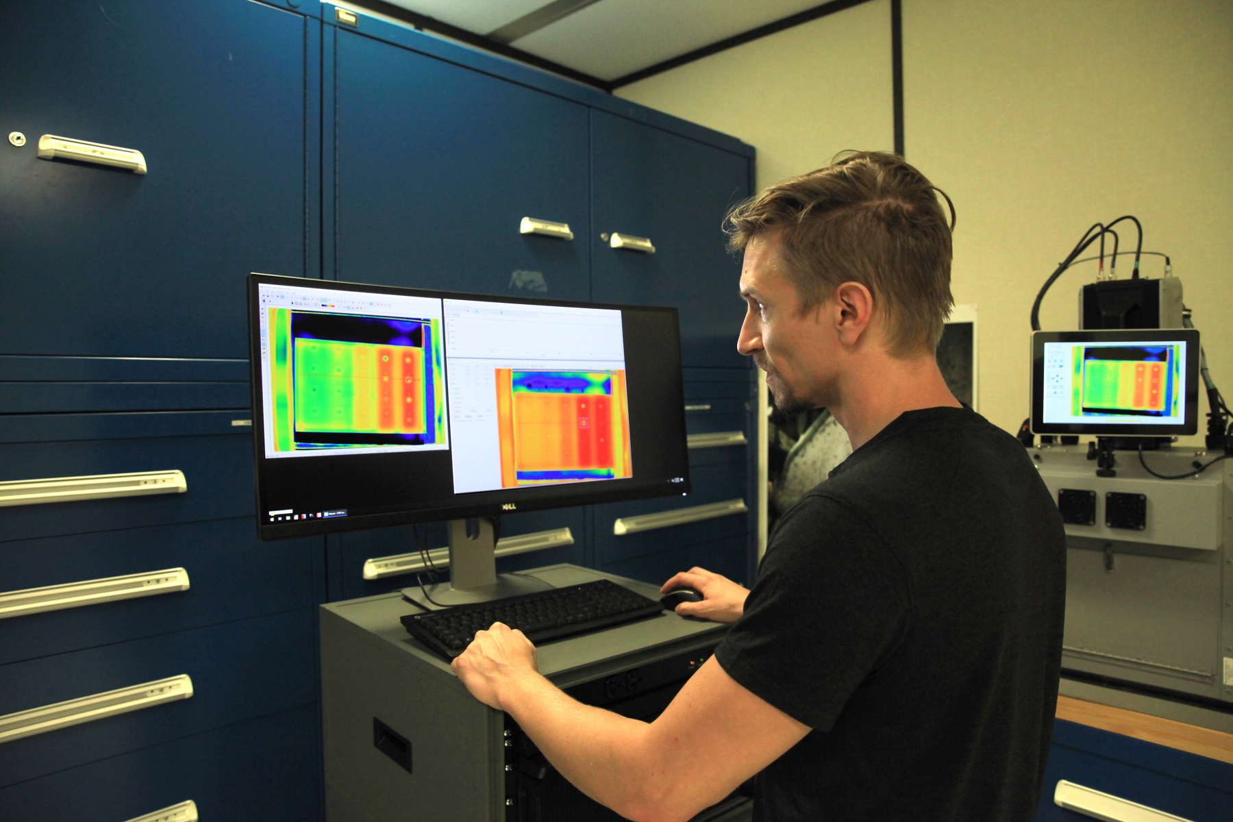 Nathan Trepal, a materials engineer in the Materials Laboratories Branch of the Engineering Directorate at NASA’s Kennedy Space Center, works with flash thermography. 