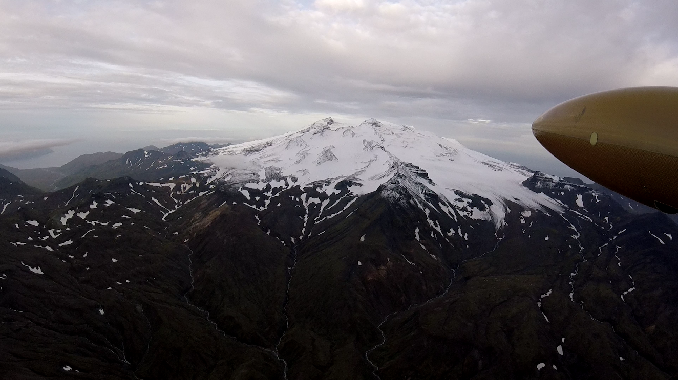 In-flight view from airborne camera of Makushin Volcano summit