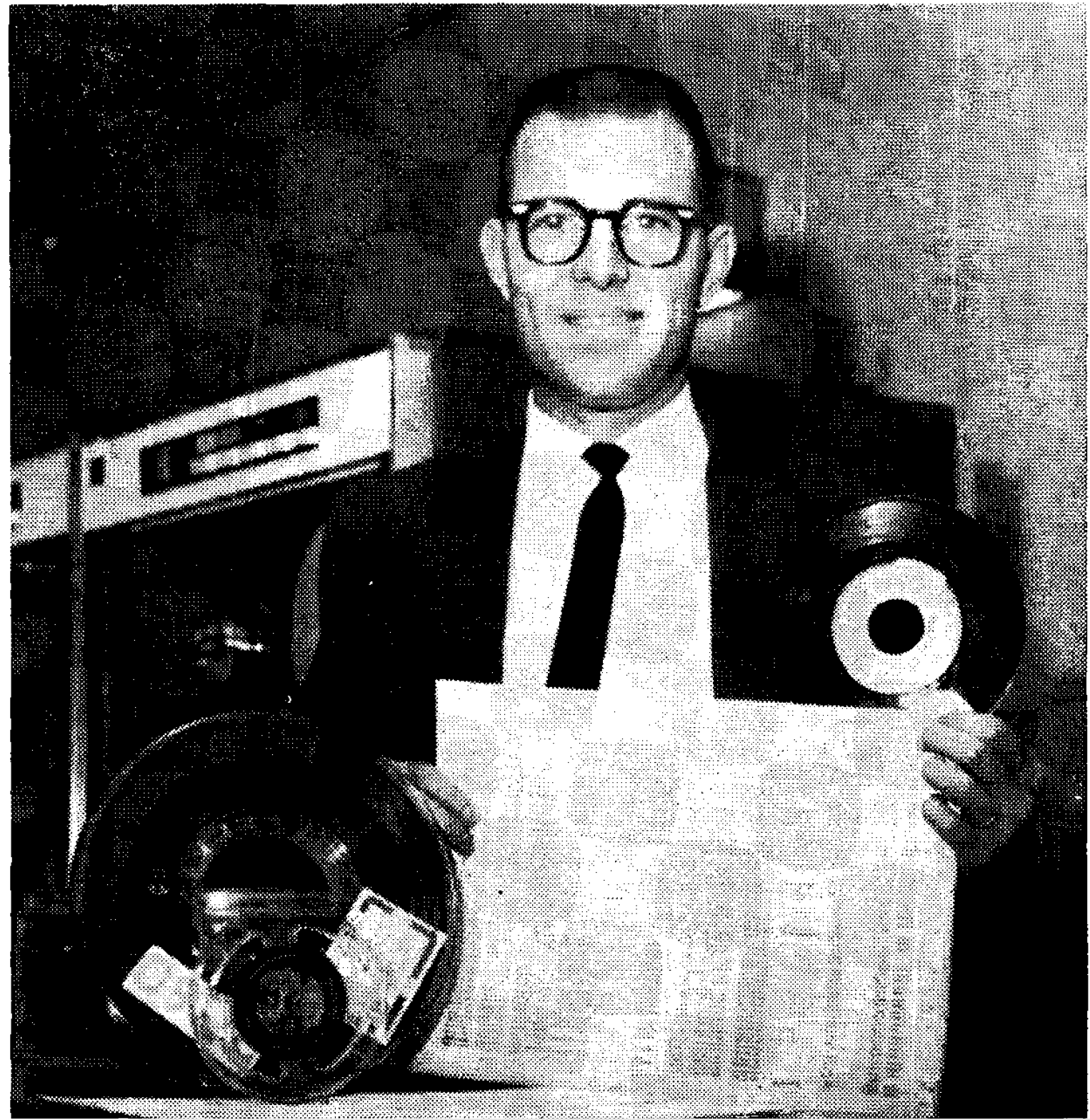Jerry Huffman in 1965 with a recording of his song “You Don’t Hear,” along with computer tapes and printouts in the Computation Laboratory. 