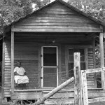 Rebecca Abrams sitting in chair on her porch in Logtown. The year is 1963.