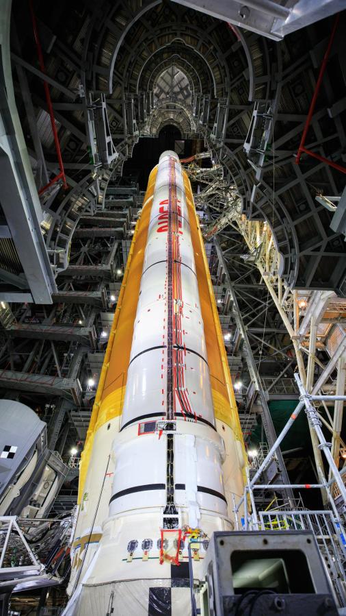 Inside High Bay 3 of the Vehicle Assembly Building at NASAâs Kennedy Space Center in Florida, the work platforms have been retracted from around the Artemis I Space Launch System on Sept. 20, 2021. All 10 levels of platforms were extended and retracted as part of an umbilical test. During the test, several umbilical arms on the mobile launcher were extended to connect to the SLS rocket. They swung away from the launch vehicle, just as they will on launch day. NASA and Jacobs teams will continue conducting tests inside the VAB before transporting the Orion spacecraft to the assembly building and stacking it atop the SLS, completing assembly of the rocket for the Artemis I mission. Artemis I will be the first integrated test of the SLS and Orion spacecraft. In later missions, NASA will land the first woman and the first person of color on the surface of the Moon, paving the way for a long-term lunar presence and serving as a steppingstone on the way to Mars.